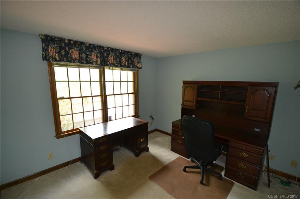 8147 Fairfield Forest Road Denver, NC 28037 - Photo 22 of 23 a room with a window and a chair