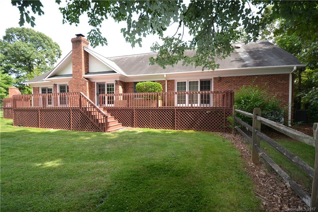 8147 Fairfield Forest Road Denver, NC 28037 - Photo 10 of 23 a view of a house with a yard and a garden
