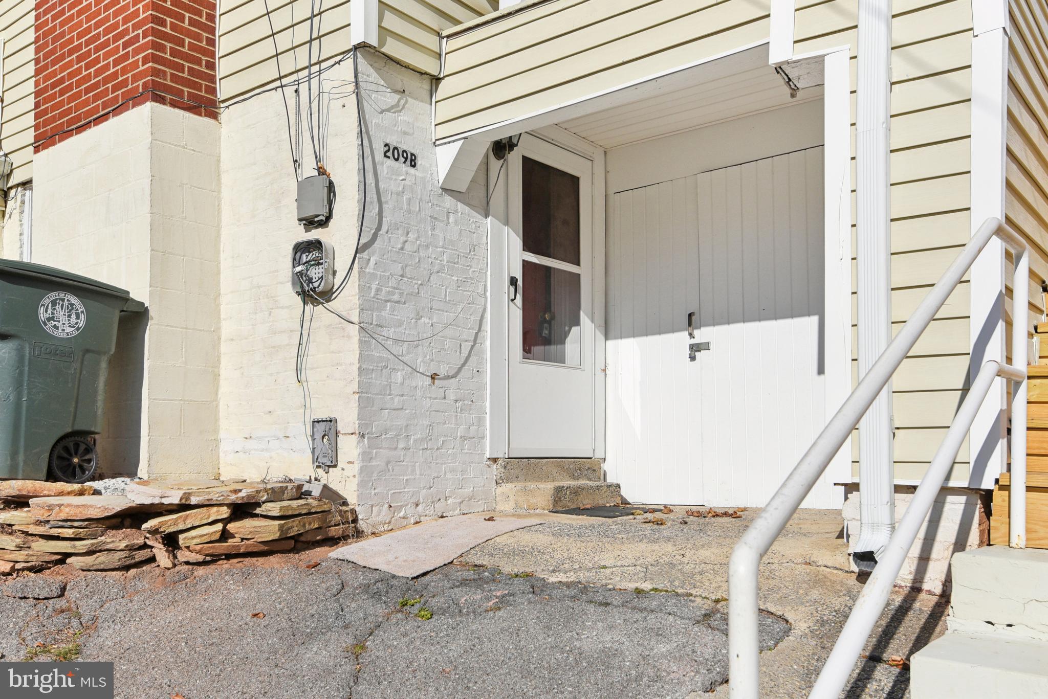 209 Locust Street, Unit B Frederick, MD 21703 - Photo 2 of 14 a backyard of a house with seating space