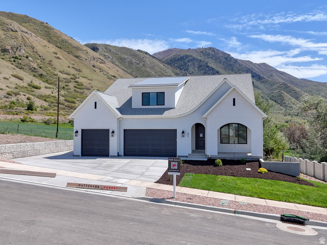82 East 1900th South Payson, UT 84651 - Photo 1 of 40 Modern farmhouse exterior with a white facade and dark grey garage doors