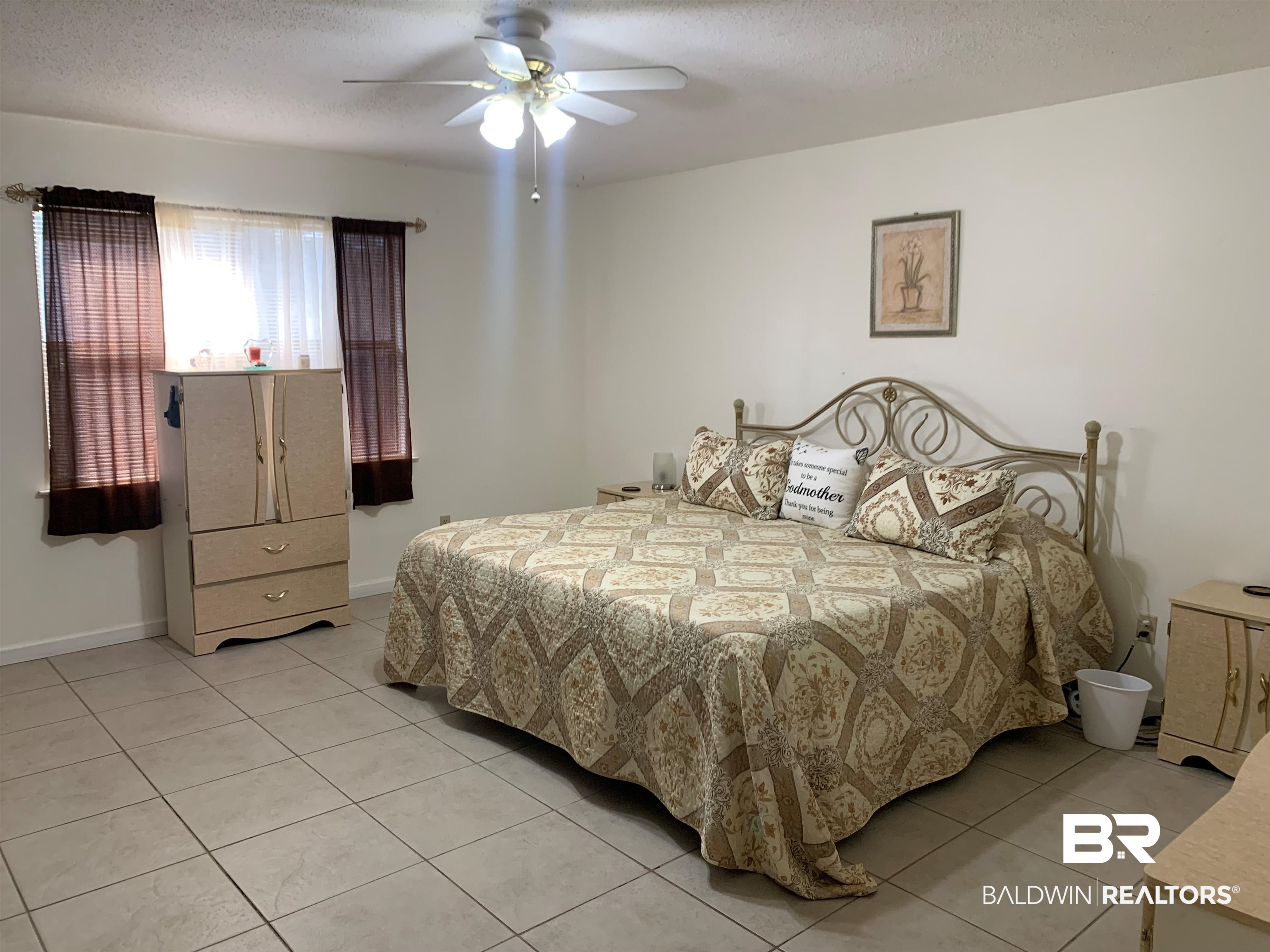 133 Dunbar Loop Daphne, AL 36526 - Photo 10 of 15 Bedroom with a textured ceiling, ceiling fan, and light tile patterned floors