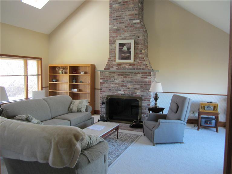 36 Torrey Road East Sandwich, MA 02537 - Photo 16 of 24 a living room with furniture and a fireplace