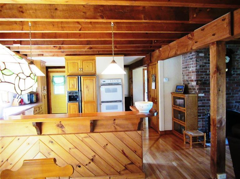 36 Torrey Road East Sandwich, MA 02537 - Photo 3 of 24 a bedroom with a bed a table and chair