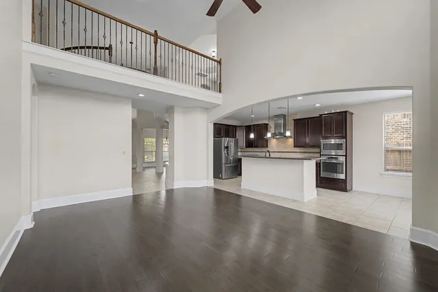 a view of kitchen with cabinets and wooden floor