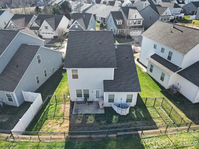 an aerial view of a house with swimming pool