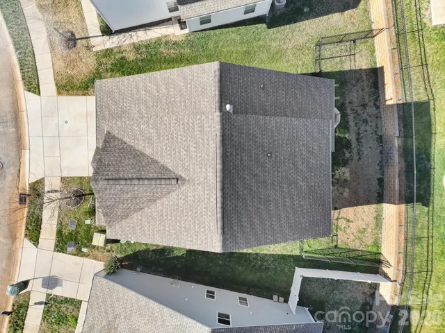a aerial view of a house with a yard
