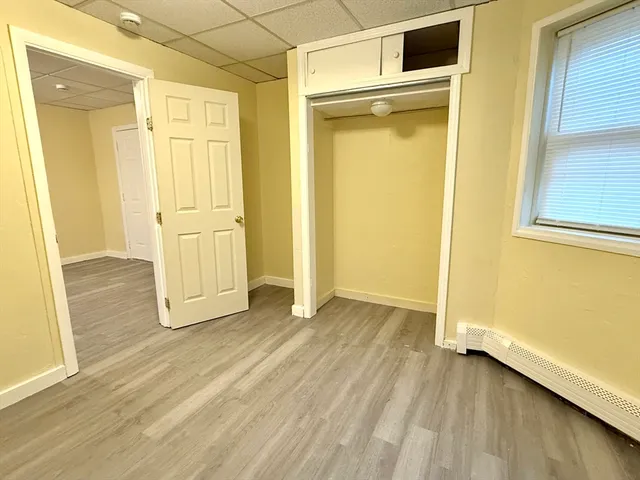 wooden floor and yellow door