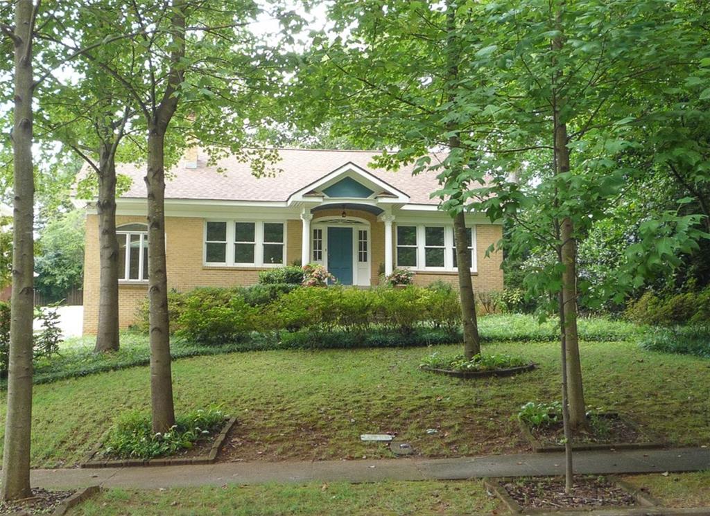 1445 Cornell Road Northeast Atlanta, GA 30306 - Photo 1 of 1 Exterior front of home. Beautiful wheat/blonde brick on all sides as well as the custom garage/workshop. Both have newer architectural roofs.