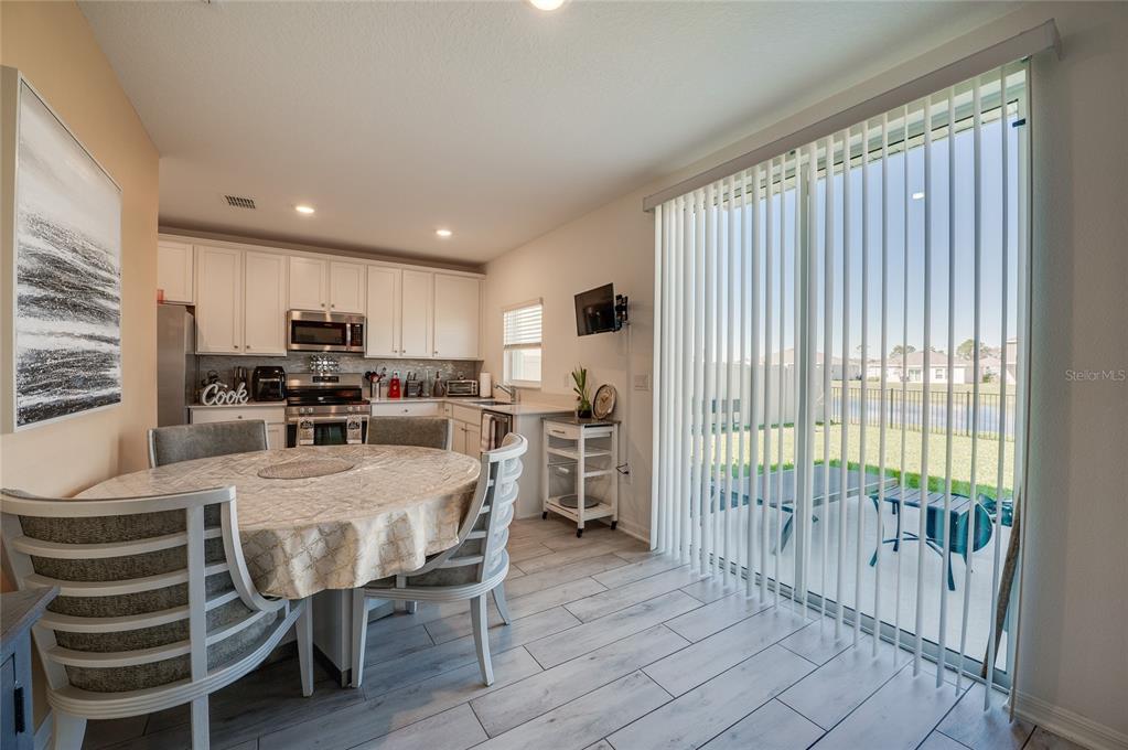 3986 Willowbrook Drive Edgewater, FL 32141 - Photo 18 of 57 a kitchen with stainless steel appliances granite countertop a refrigerator and a sink