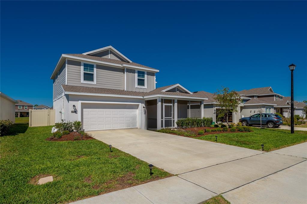 3986 Willowbrook Drive Edgewater, FL 32141 - Photo 2 of 57 a front view of a house with a yard and garage