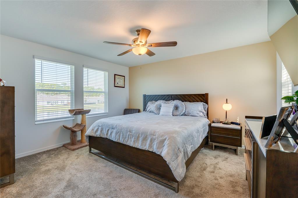 3986 Willowbrook Drive Edgewater, FL 32141 - Photo 21 of 57 a spacious bedroom with a bed and a chandelier