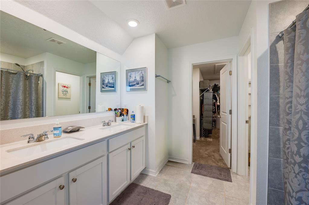 3986 Willowbrook Drive Edgewater, FL 32141 - Photo 23 of 57 a bathroom with a sink and a mirror