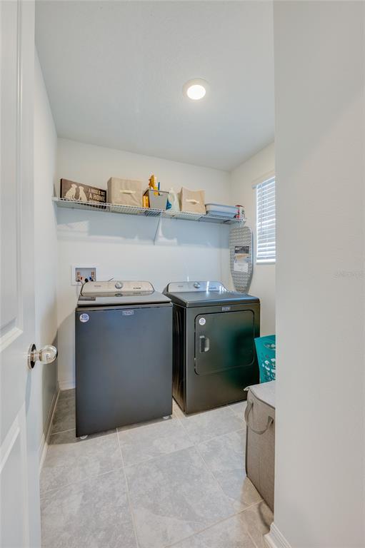 3986 Willowbrook Drive Edgewater, FL 32141 - Photo 27 of 57 a kitchen with stainless steel appliances granite countertop a sink and a stove