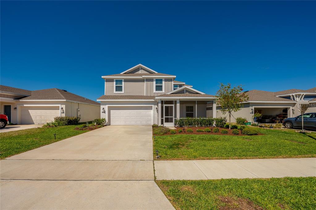 3986 Willowbrook Drive Edgewater, FL 32141 - Photo 3 of 57 a front view of a house with a garden