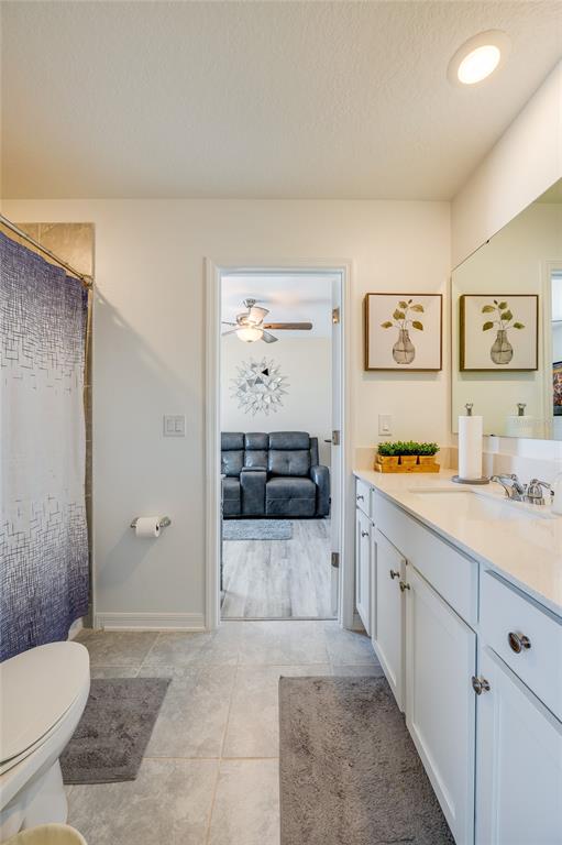 3986 Willowbrook Drive Edgewater, FL 32141 - Photo 31 of 57 a spacious bathroom with a granite countertop sink a toilet and shower