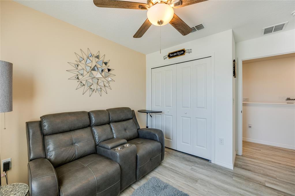 3986 Willowbrook Drive Edgewater, FL 32141 - Photo 34 of 57 a living room with furniture and a wooden floor