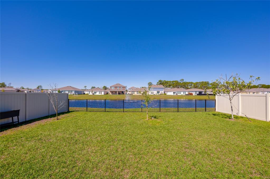 3986 Willowbrook Drive Edgewater, FL 32141 - Photo 37 of 57 a view of a lake with houses