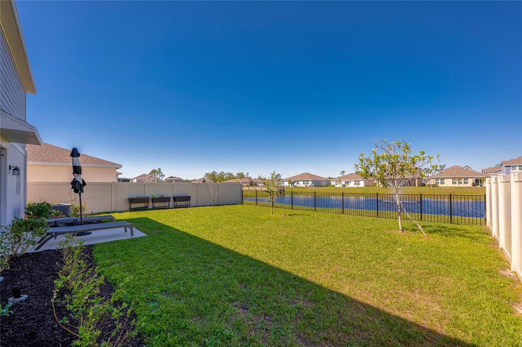 3986 Willowbrook Drive Edgewater, FL 32141 - Photo 38 of 57 a view of a swimming pool with an outdoor space and seating area