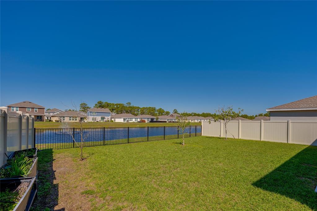 3986 Willowbrook Drive Edgewater, FL 32141 - Photo 39 of 57 a view of swimming pool with a yard