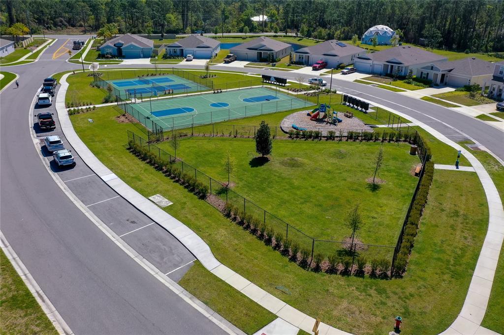 3986 Willowbrook Drive Edgewater, FL 32141 - Photo 52 of 57 a view of swimming pool with a garden and seating area