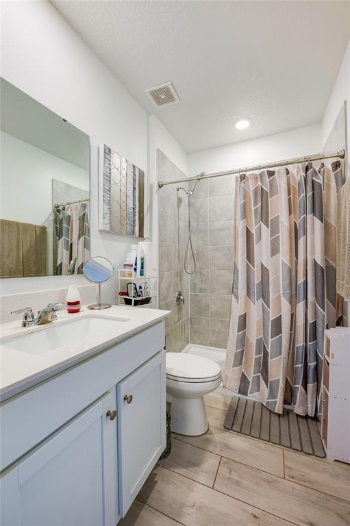 3986 Willowbrook Drive Edgewater, FL 32141 - Photo 10 of 57 a bathroom with a double vanity sink toilet and shower