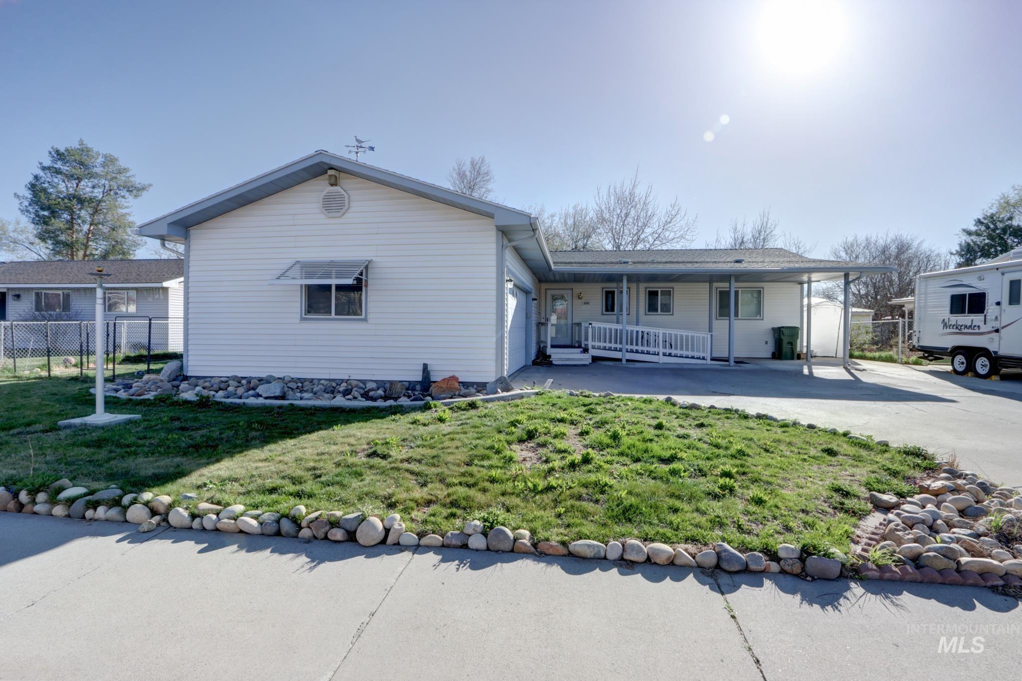 1302 Southwest 12th Street Ontario, OR 97914 - Photo 2 of 35 Single story home with covered porch and an attached garage