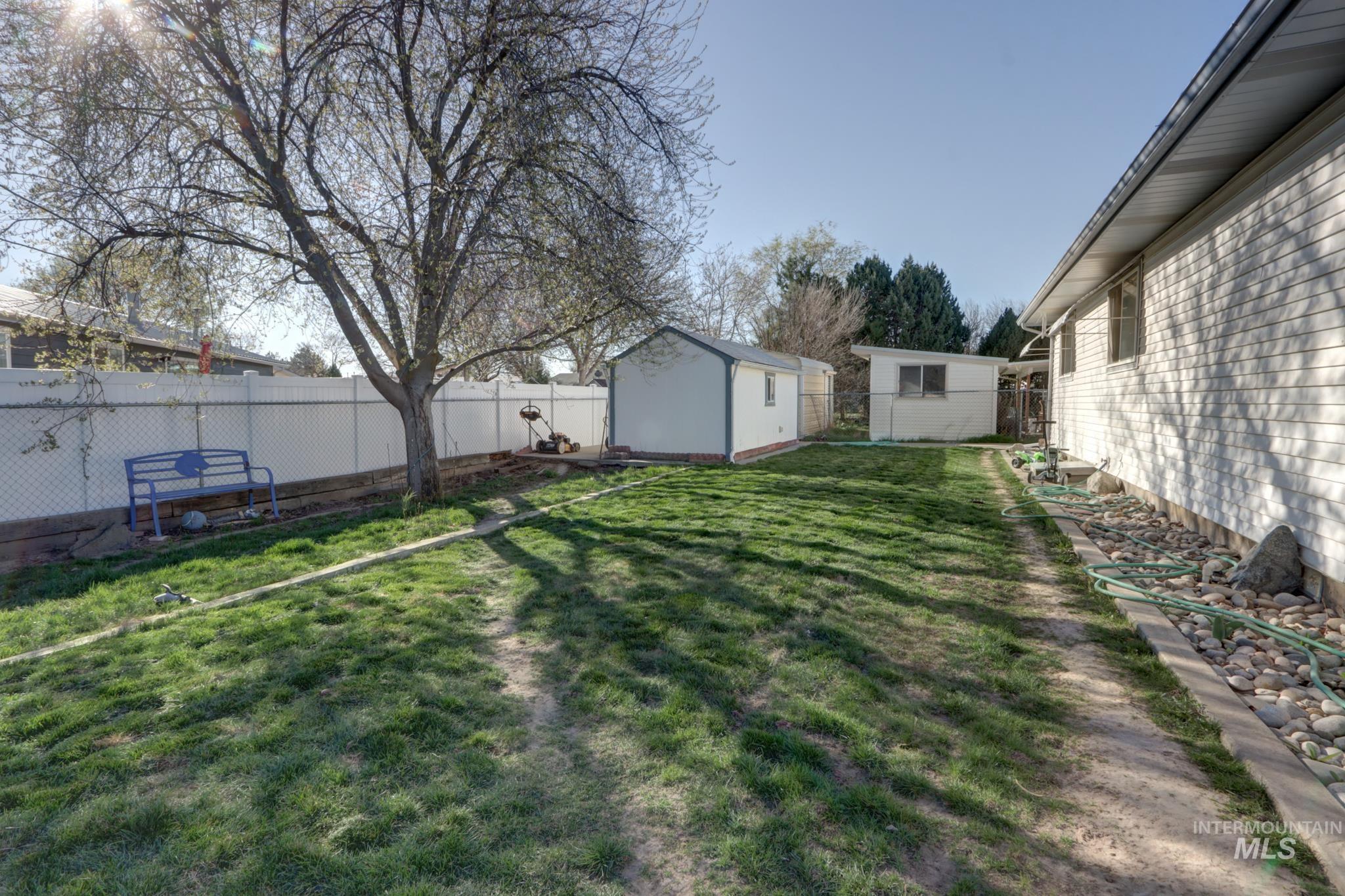 1302 Southwest 12th Street Ontario, OR 97914 - Photo 32 of 35 Fenced backyard featuring an outbuilding