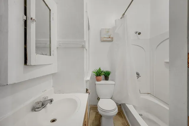 a kitchen with a sink a stove and refrigerator