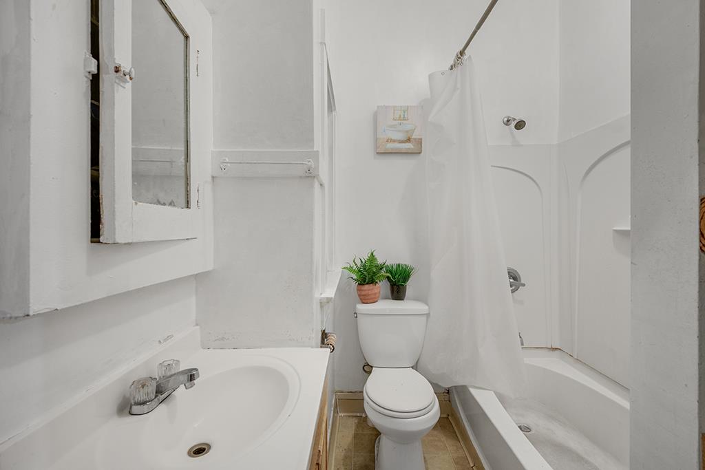 2874-2882 Telegraph Avenue Oakland, CA 94609 - Photo 8 of 18 a white toilet sitting next to a bathroom sink