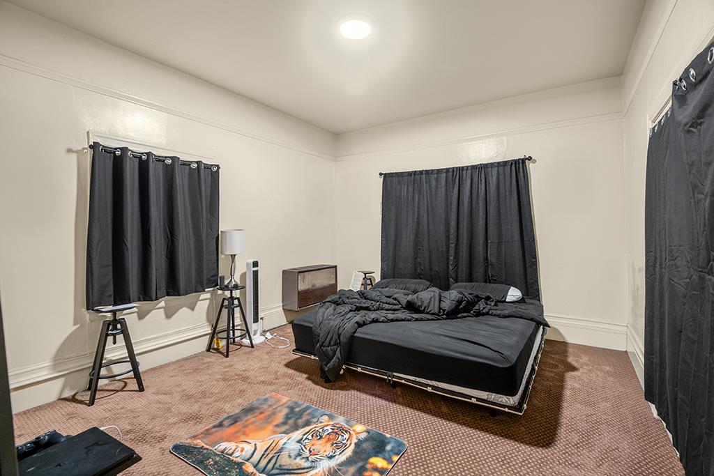 2874-2882 Telegraph Avenue Oakland, CA 94609 - Photo 10 of 18 a bedroom with furniture and a window