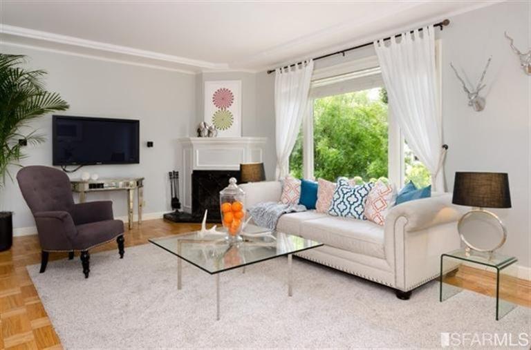 76 Rossi San Francisco, CA 94118 - Photo 12 of 30 Formal dining room in the front of the house with a wood-burning fireplace.