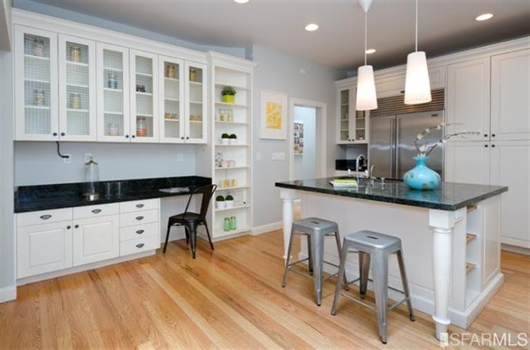 76 Rossi San Francisco, CA 94118 - Photo 4 of 30 The updated kitchen has loads of cabinet space, an island (with sink and dishwasher), and built-in shelving.