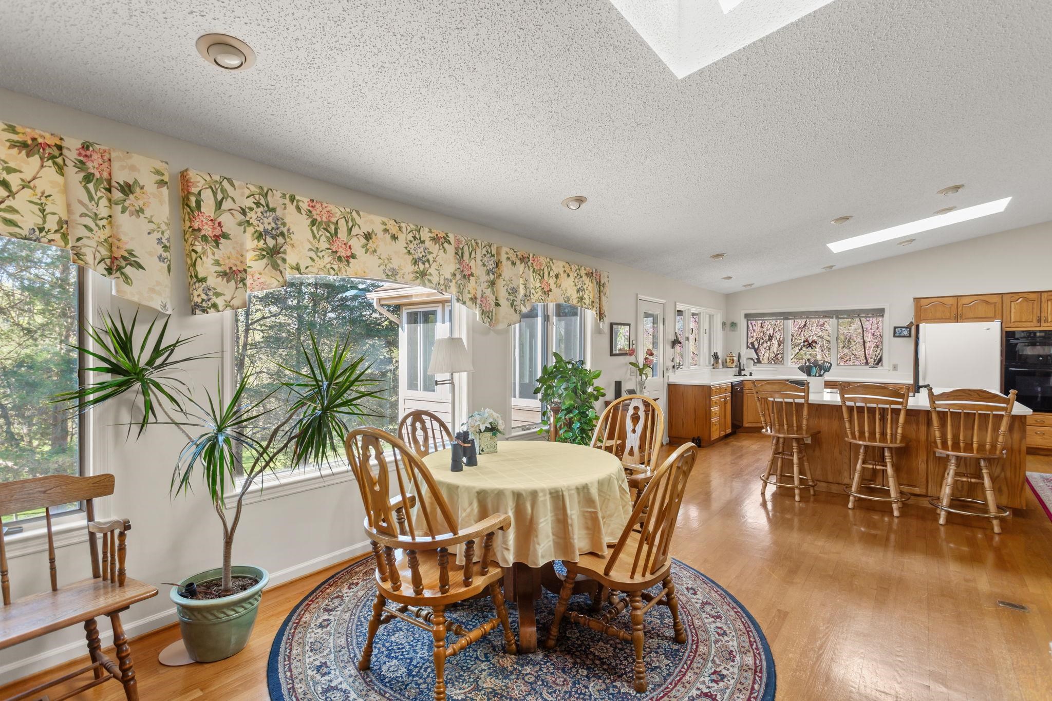 13004 Indian Trail Road Broadway, VA 22815 - Photo 11 of 56 a view of a dining room with furniture window and outside view