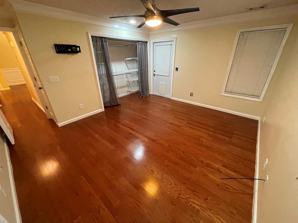 3190 Serenade Court Alpharetta, GA 30004 - Photo 11 of 41 en empty room with wooden floor and windows
