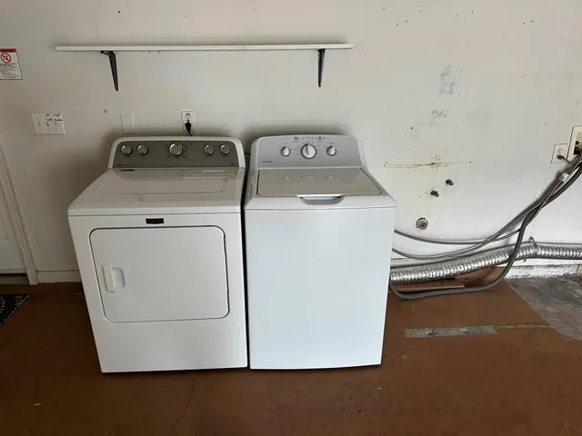 en empty room with windows and fan