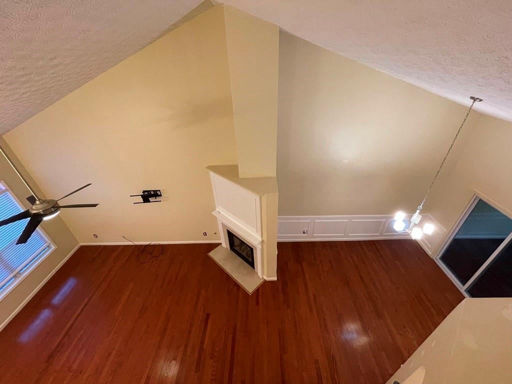 3190 Serenade Court Alpharetta, GA 30004 - Photo 6 of 41 a view of an empty room with wooden floor