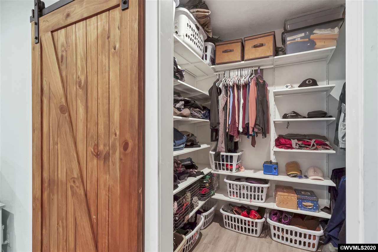 8290 Rickreall Road Rickreall, OR 97371 - Photo 22 of 40 a view of walk in closet with clothes and shoes