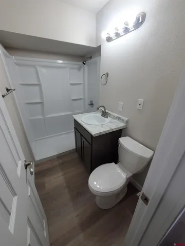 a white toilet sitting next to a bathroom sink