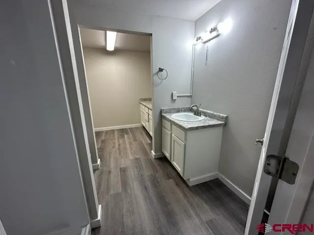 a bathroom with sink and mirror