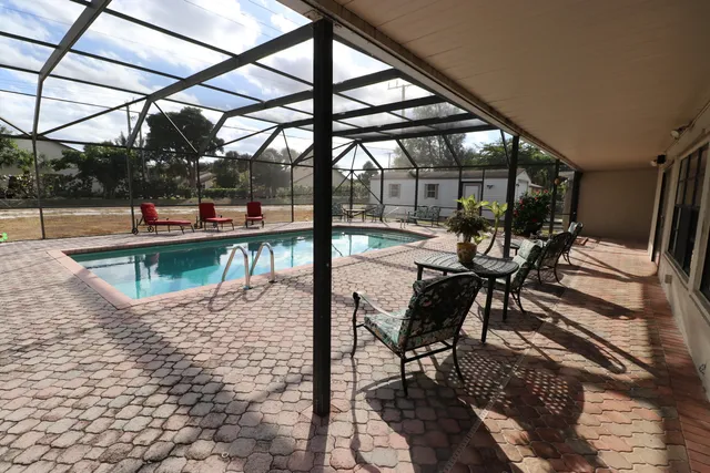a view of a swimming pool with a lounge chairs