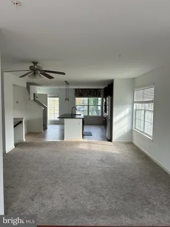 a view of empty room with a fireplace