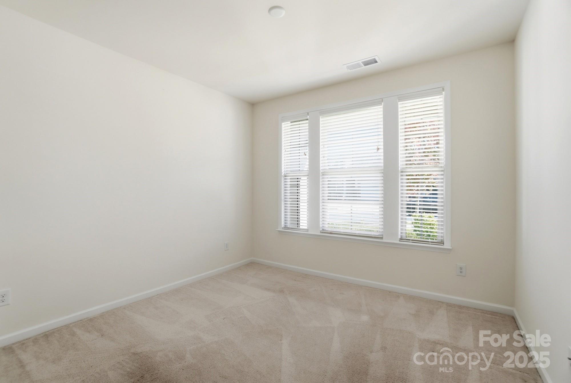 4325 Hunton Dale Road Northwest Concord, NC 28027 - Photo 16 of 42 an empty room with a window