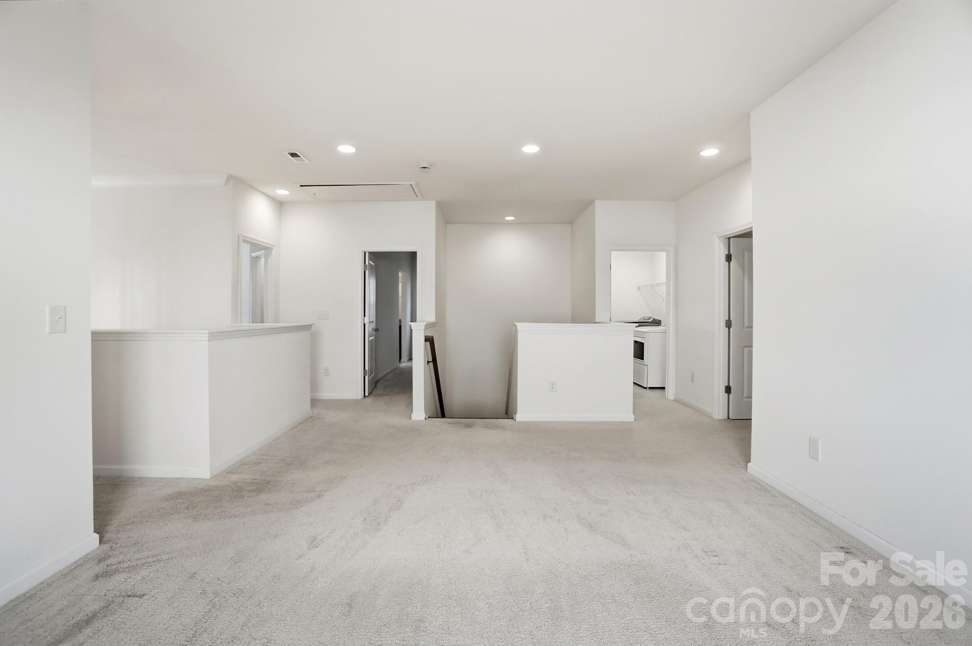 4325 Hunton Dale Road Northwest Concord, NC 28027 - Photo 22 of 42 a view of a big room with refrigerator and white walls