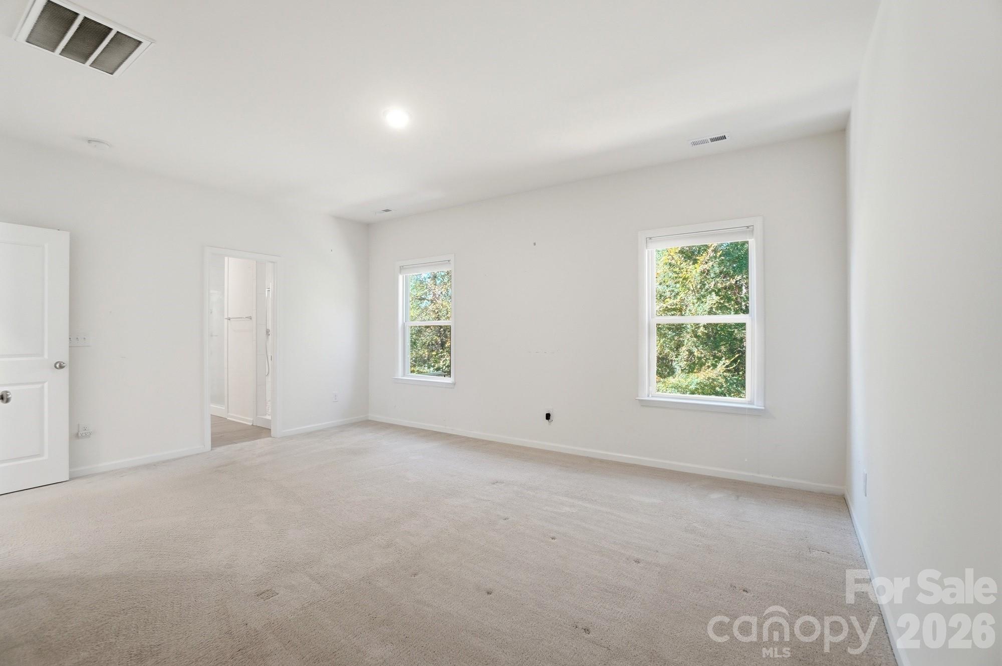 4325 Hunton Dale Road Northwest Concord, NC 28027 - Photo 23 of 42 an empty room with windows