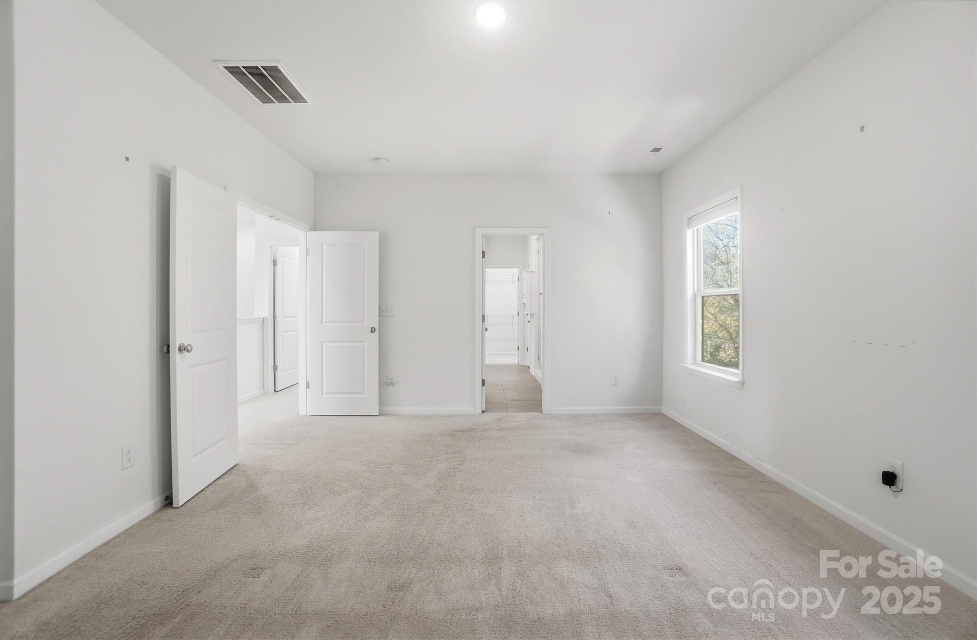 4325 Hunton Dale Road Northwest Concord, NC 28027 - Photo 25 of 42 a view of an empty room with a window