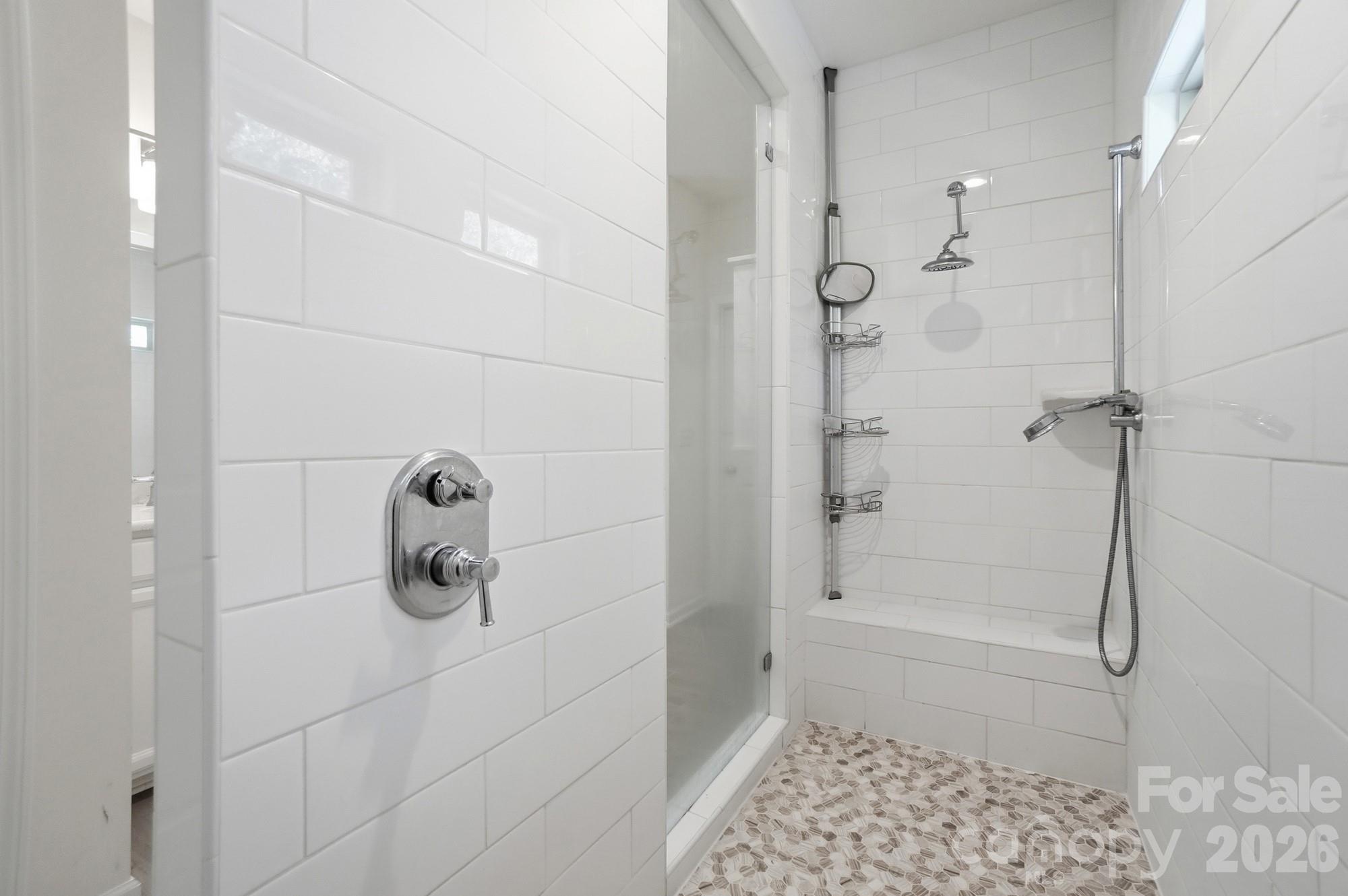 4325 Hunton Dale Road Northwest Concord, NC 28027 - Photo 25 of 42 a bathroom with a glass shower door
