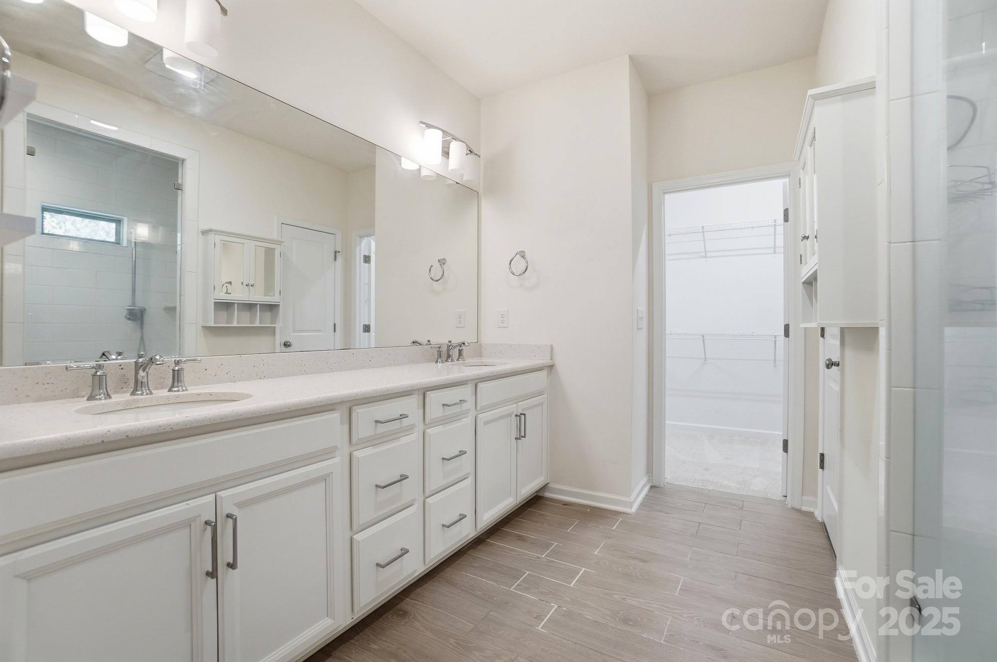 4325 Hunton Dale Road Northwest Concord, NC 28027 - Photo 27 of 42 a spacious bathroom with double sink and a mirror