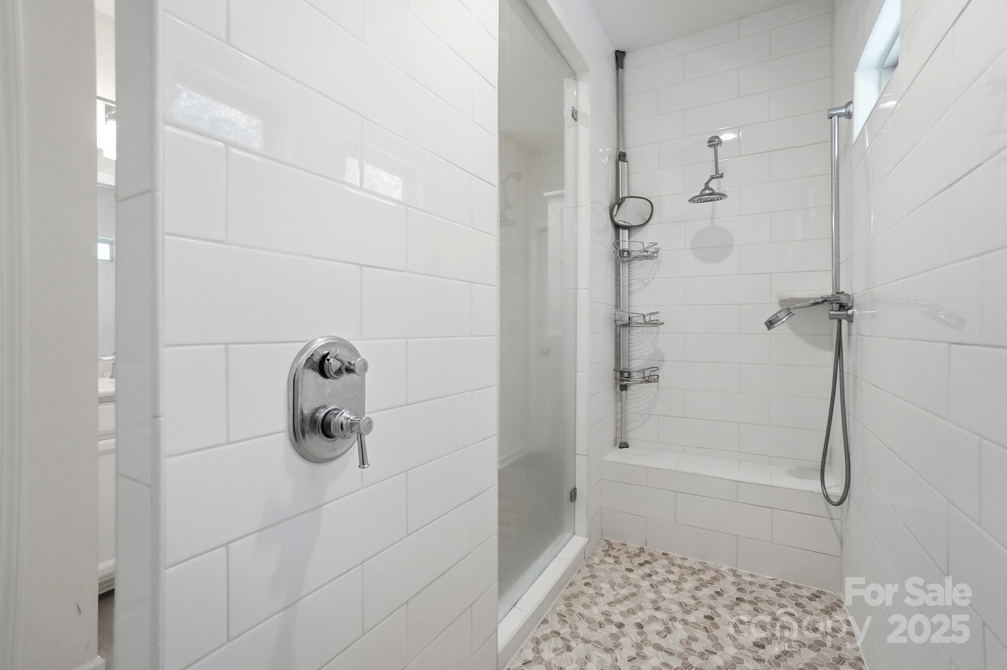 4325 Hunton Dale Road Northwest Concord, NC 28027 - Photo 28 of 42 a bathroom with a glass shower door