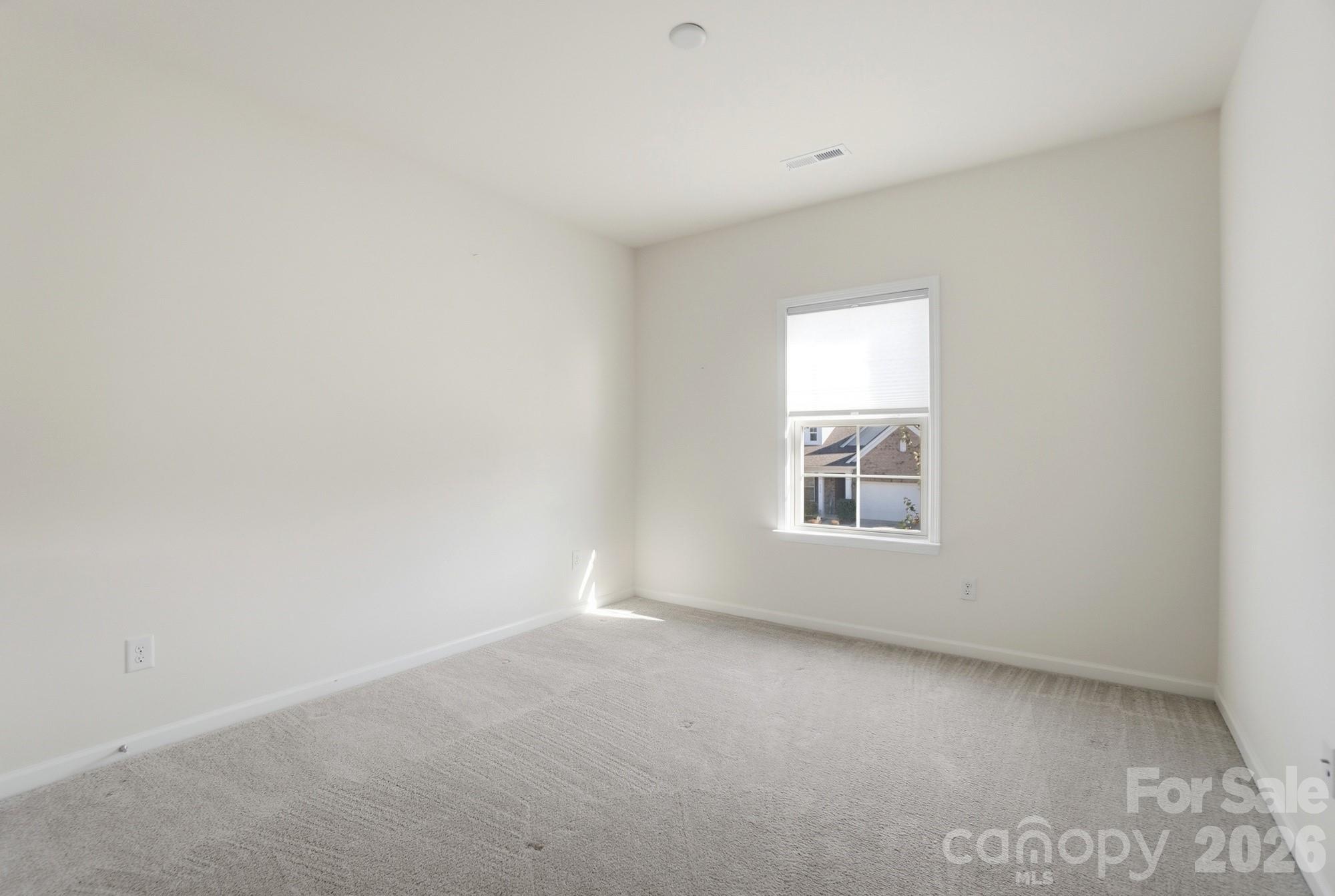 4325 Hunton Dale Road Northwest Concord, NC 28027 - Photo 30 of 42 an empty room with a window