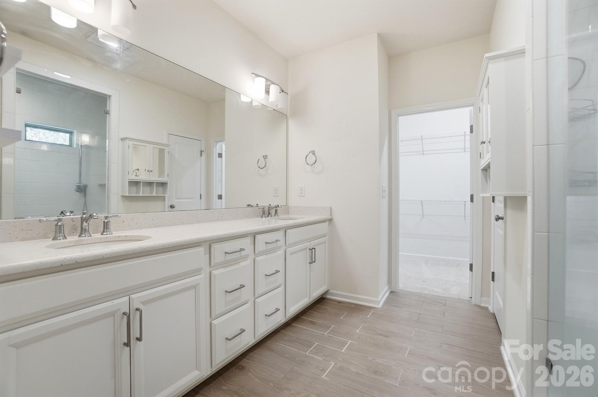 4325 Hunton Dale Road Northwest Concord, NC 28027 - Photo 3 of 42 a spacious bathroom with double sink and a mirror